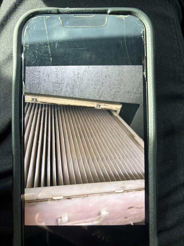 Completed cooling maintenance club visit for air handler experiencing rattling noise. Performed diagnostic testing with digital multimeter, obtaining readings on electrical components. Inspected and documented HVAC filter condition, which appeared clean with proper pleating intact and filter housing secure.