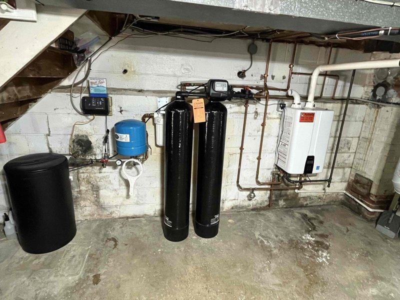 Responded to customer concerns regarding rotten egg odor occurring during water treatment system regeneration cycles and potential bacterial growth within the equipment. Documented the dual-tank water softener/filtration system installation and associated plumbing components, forwarded customer's detailed concerns via email for technical review and recommendations regarding system sanitization or media replacement to address odor issues.