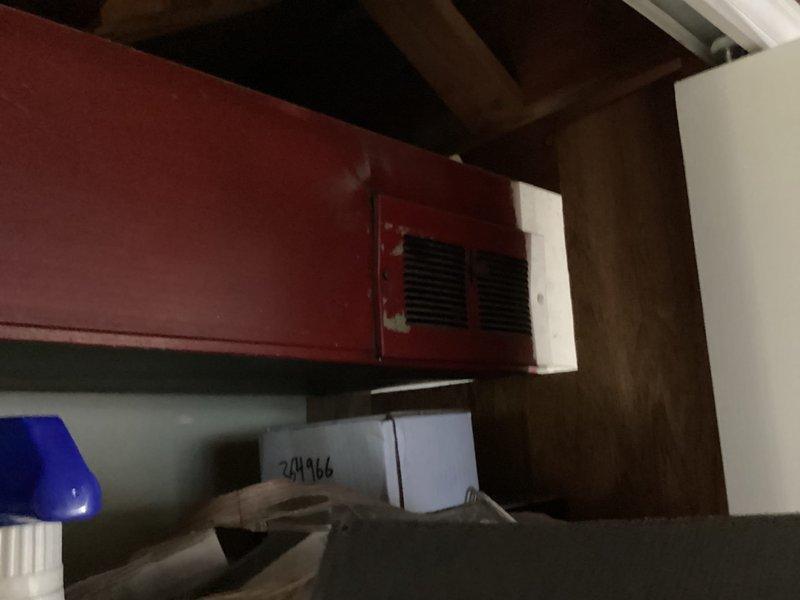 Performed comprehensive AC tune-up on 40-year-old air conditioning system currently operating without issues. Conducted standard maintenance inspection and servicing procedures, documenting equipment condition through interior component photography showing copper refrigerant lines, mounting hardware, and cabinet structure. System found to be functioning properly with no reported symptoms or accessibility concerns at time of service.