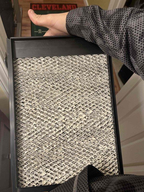 Completed routine heating maintenance member visit on air handler system. Inspected and documented heavily soiled air filter showing significant dust and debris accumulation, then replaced with new filter to restore proper airflow and system efficiency. All heating system components checked and found operating within normal parameters.