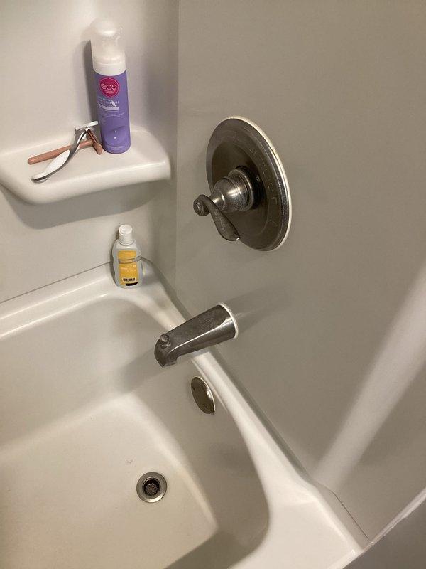 Completed sales consultation for plumbing repairs in residential bathroom. Assessed existing fixtures including bathtub/shower combination with chrome hardware and bronze finish bathroom faucet on marble countertop. Provided estimate for well cap installation and recommended repair work to address identified plumbing needs.