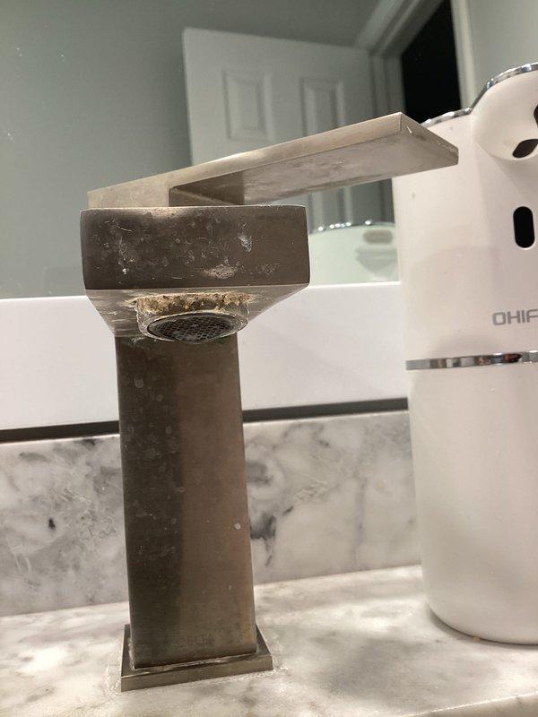 Completed sales consultation for plumbing repairs in residential bathroom. Assessed existing fixtures including bathtub/shower combination with chrome hardware and bronze finish bathroom faucet on marble countertop. Provided estimate for well cap installation and recommended repair work to address identified plumbing needs.