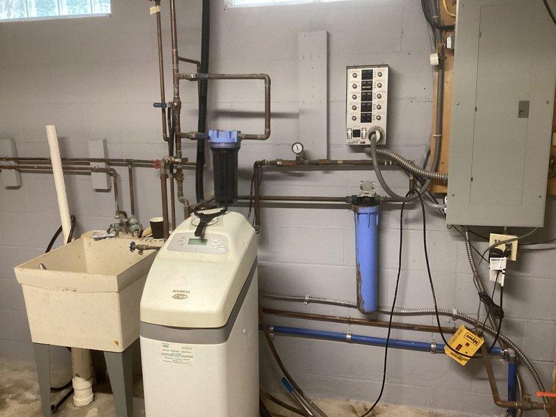 Conducted comprehensive assessment of existing American Standard/Trane forced air furnace system for replacement estimate. Evaluated current water treatment infrastructure including dual softener units, filtration system with multiple housings, and associated copper plumbing configuration to provide recommendations for sump pump replacement, hot water tank upgrade, reverse osmosis system modifications, and cistern installation feasibility.