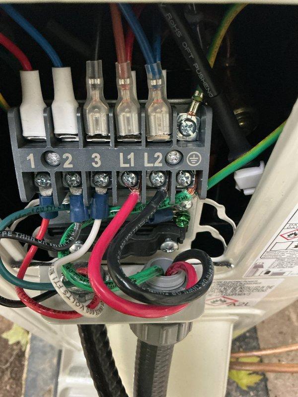 Returned to site to complete mini-split system startup and commissioning. Verified all electrical connections at the terminal block, including power supply wiring (L1, L2) and control circuit connections, ensuring proper voltage distribution and secure terminations. Confirmed system energized successfully with all components operating within manufacturer specifications.