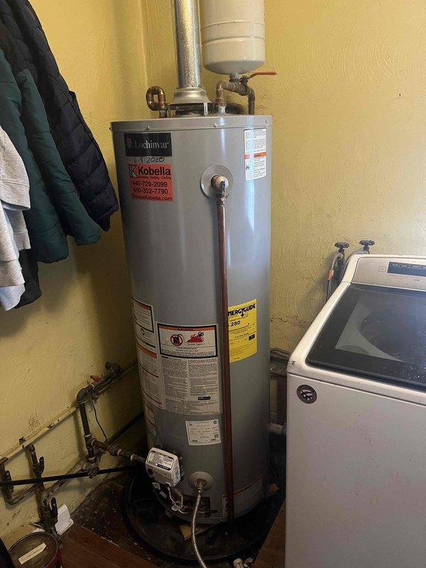 # Gas Water Heater Overheat Condition - No Start

Responded to service call for 40-gallon gas water heater displaying 4 flash error code indicating overheat condition with elevated water temperature. Upon arrival, inspected AO Smith ProLine unit and confirmed status light flashing 4 times, consistent with high limit switch activation. Attempted reset procedures but unit would not restart. Documented existing installation including expansion tank, copper supply lines, and gas connections. Unable to restore operation during initial visit; additional diagnostic work and parts required to resolve overheat condition and restore hot water service.