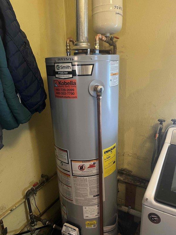 # Gas Water Heater Overheat Condition - No Start

Responded to service call for 40-gallon gas water heater displaying 4 flash error code indicating overheat condition with elevated water temperature. Upon arrival, inspected AO Smith ProLine unit and confirmed status light flashing 4 times, consistent with high limit switch activation. Attempted reset procedures but unit would not restart. Documented existing installation including expansion tank, copper supply lines, and gas connections. Unable to restore operation during initial visit; additional diagnostic work and parts required to resolve overheat condition and restore hot water service.