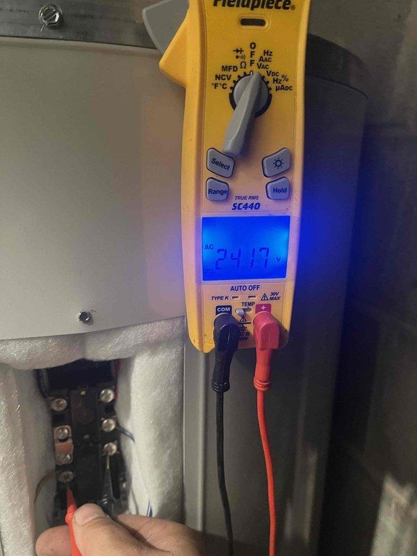 Arrived on site and shut off power to the water heater at the electrical panel as required for the tanked water heater flush service. Verified power disconnection using a digital multimeter, confirming zero voltage at the heating element terminals before proceeding with maintenance. Inspected the Bradford White automatic storage water heater, noting specifications of 240V/208V operation with 4500W heating elements and 150 PSI working pressure rating. Completed the water heater flush procedure to remove sediment buildup from the tank bottom, ensuring optimal heating efficiency and extending equipment lifespan. Restored electrical power and confirmed proper operation upon completion.
