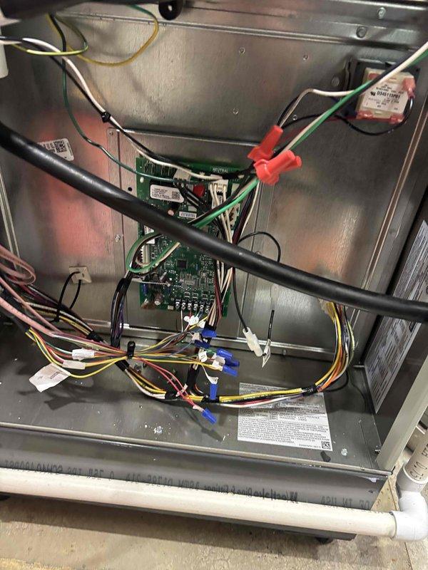 Completed heating season startup and inspection on air handler unit. Verified electrical connections, tested amperage draw showing 0.51A on blower motor, and confirmed all control boards and safety circuits functioning properly. Unit operational and ready for heating season.