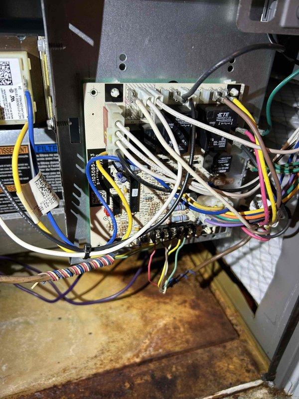 Completed final prepaid heating maintenance visit on air handler system. Performed comprehensive inspection of HVAC control panel, low-voltage wiring assembly, and internal mechanical components. Documented existing conditions including visible corrosion on base platform and copper piping connections, along with dust accumulation on heat exchanger panels and operational wear consistent with system age. All electrical connections, terminal blocks, relays, and control wiring verified as secure and functional during routine maintenance inspection.