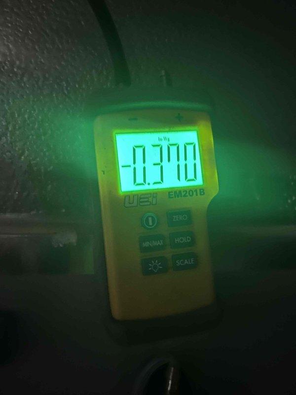 Responded to emergency maintenance call for leaking gas water heater in basement. Upon arrival, found active leak requiring homeowner to shut off main water supply to prevent flooding. Performed diagnostic pressure testing using digital manometer to assess system conditions and identify leak source. Evaluated need for shut off valve installation to isolate water heater from main supply line for future maintenance and emergency situations.