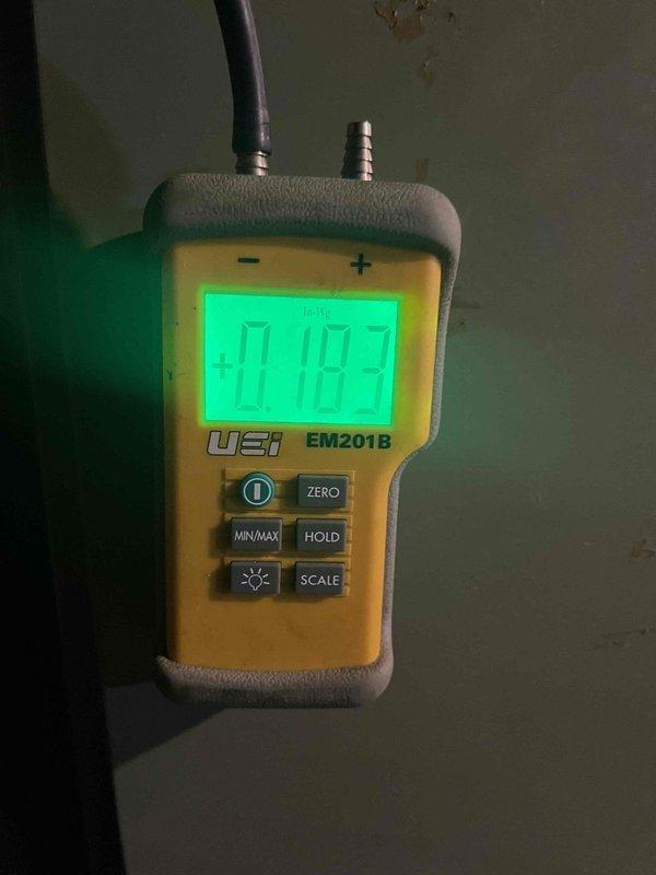 Responded to emergency maintenance call for leaking gas water heater in basement. Upon arrival, found active leak requiring homeowner to shut off main water supply to prevent flooding. Performed diagnostic pressure testing using digital manometer to assess system conditions and identify leak source. Evaluated need for shut off valve installation to isolate water heater from main supply line for future maintenance and emergency situations.