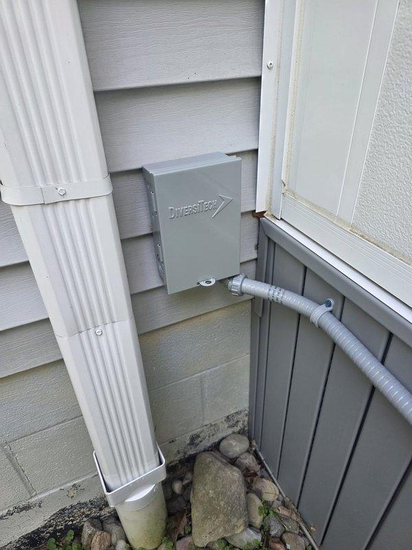 Completed mini split installation with exterior line set and electrical disconnect properly mounted and secured to building exterior. Customer received full system and paid in full at time of installation. Noted existing electronic air cleaner on forced air system is non-functional; customer expressed interest in replacement or upgrade options for future service.