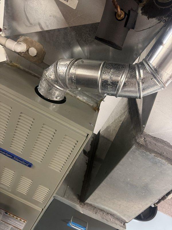 Completed heating maintenance club visit during scheduled appointment window. Performed standard seasonal inspection of residential furnace system, including filter replacement with new Flanders brand air filters. Inspected ductwork assembly, condensate drain system with PVC piping, and verified proper operation of heating equipment. All components found in good working condition with no immediate service needs identified.
