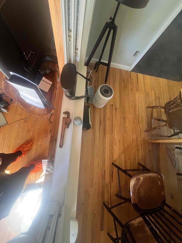 Conducted on-site assessment for adding heating options to a single room. Evaluated existing gas line configuration and provided estimate for rerouting exterior gas line to interior of residence. Customer declined full mini-split system installation due to budget considerations. Documented existing conditions with measurements and photographic evidence of work area, including floor layout and gas line accessibility points.