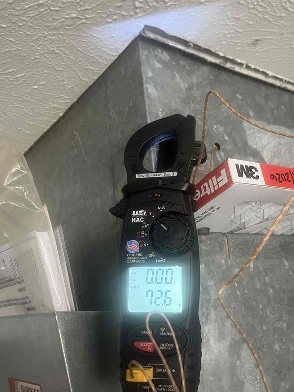 Responded to service call for noise complaint from air handler unit. Upon arrival, performed diagnostic inspection of electrical components and measured system amperage readings using clamp meter, which indicated 92.6 amps. Opened electrical compartment and inspected capacitor, contactor, and associated wiring connections. All electrical components appeared to be in normal operating condition with proper wire connections and no visible signs of failure or excessive wear. System operational at time of inspection.