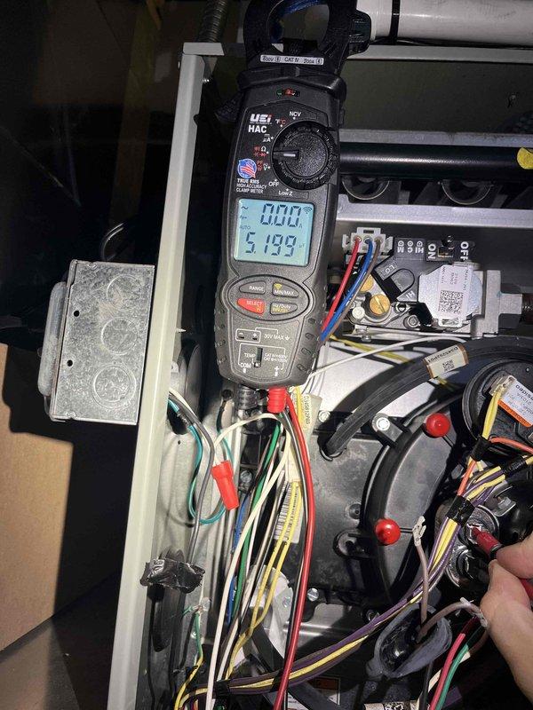 Responded to emergency no-heat call for 2-year-old furnace system. Upon arrival, performed comprehensive electrical diagnostics using clamp meter to measure amperage draw and verify proper power supply to all system components. Testing revealed 51.93-amp reading during diagnostic procedures, indicating active current flow through the circuit. Inspected all wire connections, terminals, and safety devices within the control panel and blower compartment. Verified proper voltage to motors, capacitors, and control board. System restored to full operational status with heat confirmed functioning properly at time of departure.