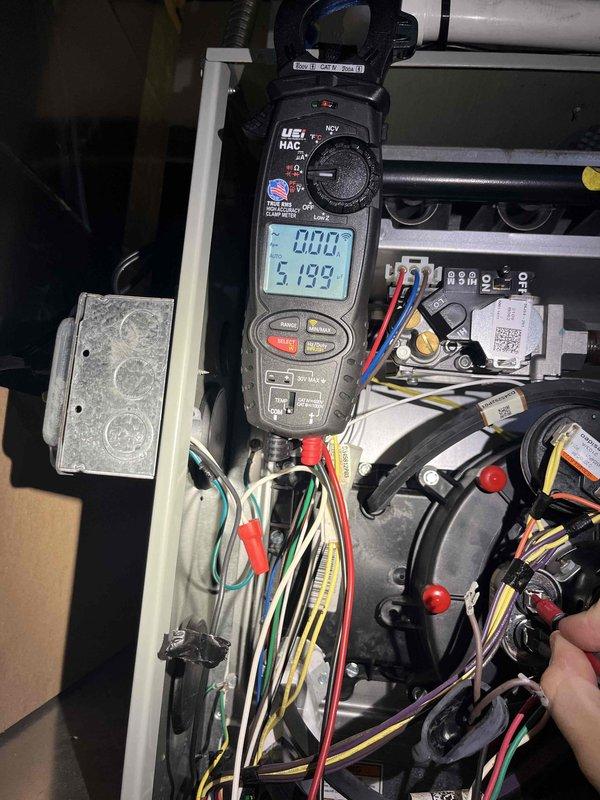 Responded to emergency no-heat call for 2-year-old furnace system. Upon arrival, performed comprehensive electrical diagnostics using clamp meter to measure amperage draw and verify proper power supply to all system components. Testing revealed 51.93-amp reading during diagnostic procedures, indicating active current flow through the circuit. Inspected all wire connections, terminals, and safety devices within the control panel and blower compartment. Verified proper voltage to motors, capacitors, and control board. System restored to full operational status with heat confirmed functioning properly at time of departure.