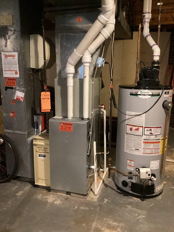 Completed heating system tune-up and maintenance inspection on residential furnace as part of club membership visit. Performed combustion analysis using Testo 310 analyzer, recording oxygen levels at 90% and carbon monoxide at 6.72%, confirming proper burner operation and venting. Inspected furnace, air handler, and associated mechanical equipment in basement, verified all components operating within normal parameters, and documented system condition with photos.