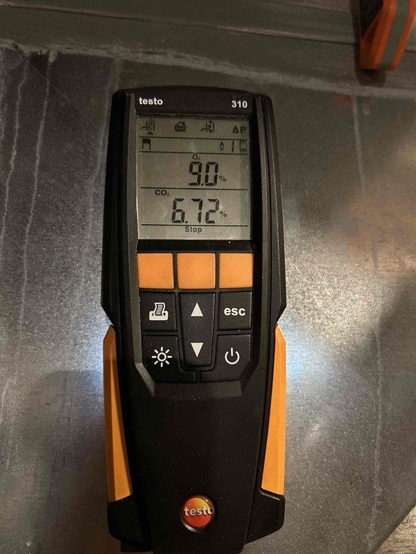 Completed heating system tune-up and maintenance inspection on residential furnace as part of club membership visit. Performed combustion analysis using Testo 310 analyzer, recording oxygen levels at 90% and carbon monoxide at 6.72%, confirming proper burner operation and venting. Inspected furnace, air handler, and associated mechanical equipment in basement, verified all components operating within normal parameters, and documented system condition with photos.
