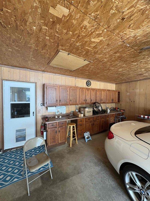 Conducted on-site estimate for new mini split system installation at residential property with no existing mini split equipment. Evaluated electrical panel capacity and confirmed adequate breaker space and electrical infrastructure to support new system installation. Assessed garage installation location, noting OSB ceiling construction, wood paneling, and concrete flooring suitable for indoor unit mounting and condensate drainage routing. Provided comprehensive quote for complete mini split system installation including indoor air handler, outdoor condenser unit, refrigerant line set, electrical connections, and all necessary mounting hardware and accessories.