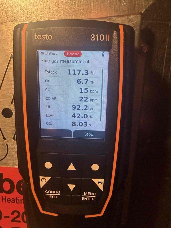 Responded to no heat call on furnace system. Thermostat was clicking but system not producing heat. Performed complete system diagnostics and combustion analysis using Testo 310 II flue gas analyzer. Verified furnace operation and measured combustion efficiency at 92.2% with stack temperature of 117.3°F. Carbon monoxide levels measured at 15 ppm in flue and 22 ppm air-free, oxygen at 6.7%, and CO2 at 8.03% - all readings within acceptable parameters. Excess air measured at 42.0%. Identified and resolved issue preventing heat call from thermostat. System restored to proper operation with all safety parameters confirmed within manufacturer specifications.