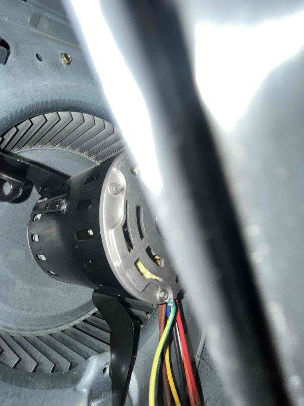 Completed heating maintenance club visit on air handler unit. Performed thorough inspection of blower motor assembly, verified proper electrical connections on all motor leads, and confirmed blower wheel operation. All components found in good working condition with normal operational wear patterns.