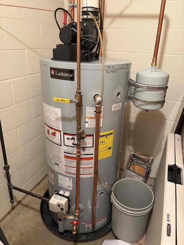 Completed follow-up visit for recirculation pump installation on existing Lochinvar water heater system. The recirculation pump was previously sold and received, then installed at the top of the water heater unit with proper copper piping connections and electrical wiring. Installation was coordinated around scheduling constraints and completed within the estimated two-hour timeframe. System includes expansion tank and all necessary safety components with proper labeling intact.