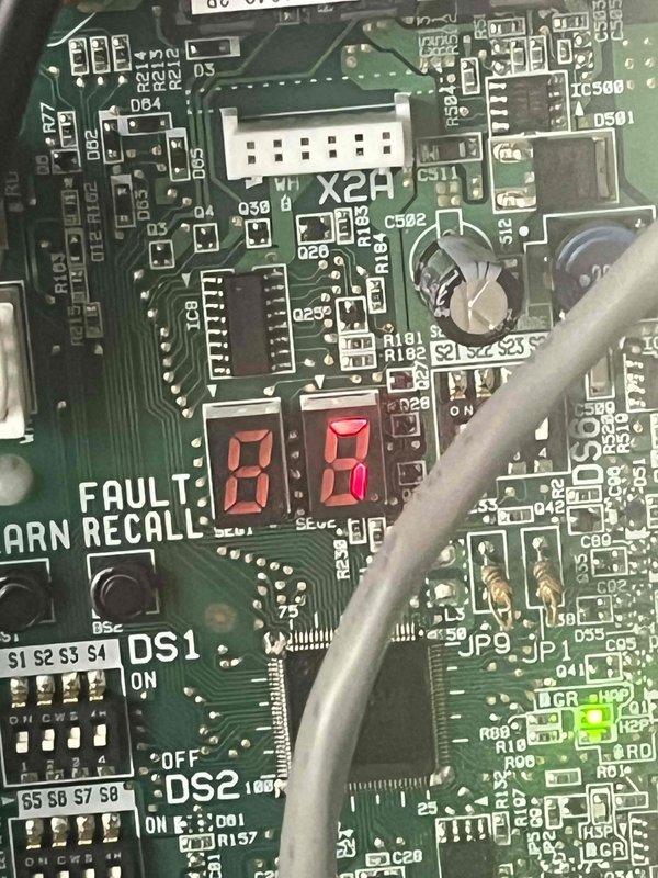 Responded to communication failure between newly installed 1-year-old heat pump, 19-year-old furnace, and 1-year-old thermostat where system would not shut down when commanded and required breaker intervention to stop operation. Inspected furnace control board and identified fault codes on integrated circuit board display showing "80" error. Examined RectorSeal RSH-VRM60A voltage regulation module wiring connections and verified proper L1/L2 input and output terminations. Diagnosed control signal interference preventing proper system shutdown sequence. Reconfigured DIP switch settings on furnace control board to establish correct communication protocol between heat pump and air handler. Tested thermostat commands through multiple heating, cooling, and off cycles to confirm proper system response and verified unit now shuts down completely when set to off position without requiring breaker reset.