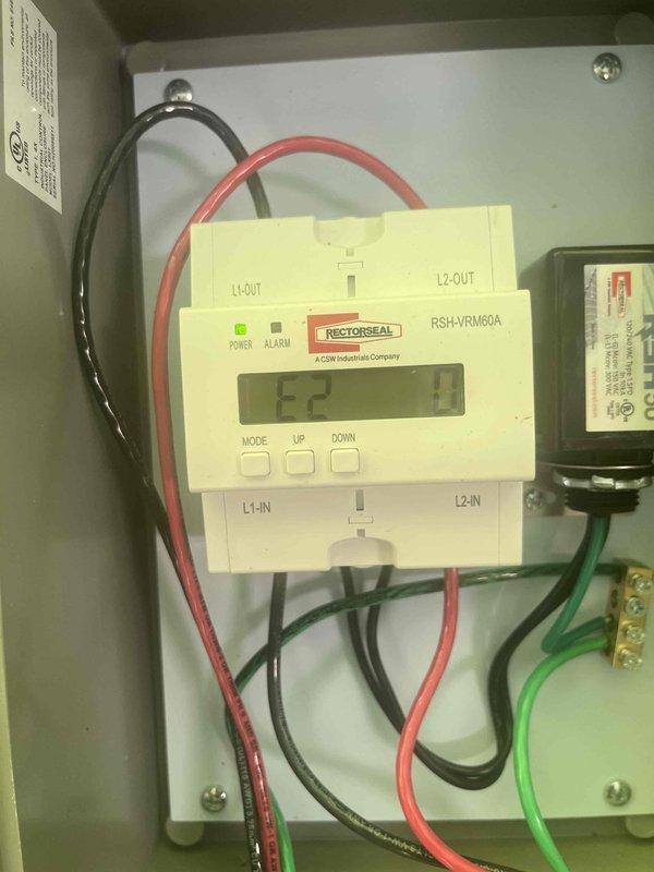 Responded to communication failure between newly installed 1-year-old heat pump, 19-year-old furnace, and 1-year-old thermostat where system would not shut down when commanded and required breaker intervention to stop operation. Inspected furnace control board and identified fault codes on integrated circuit board display showing "80" error. Examined RectorSeal RSH-VRM60A voltage regulation module wiring connections and verified proper L1/L2 input and output terminations. Diagnosed control signal interference preventing proper system shutdown sequence. Reconfigured DIP switch settings on furnace control board to establish correct communication protocol between heat pump and air handler. Tested thermostat commands through multiple heating, cooling, and off cycles to confirm proper system response and verified unit now shuts down completely when set to off position without requiring breaker reset.