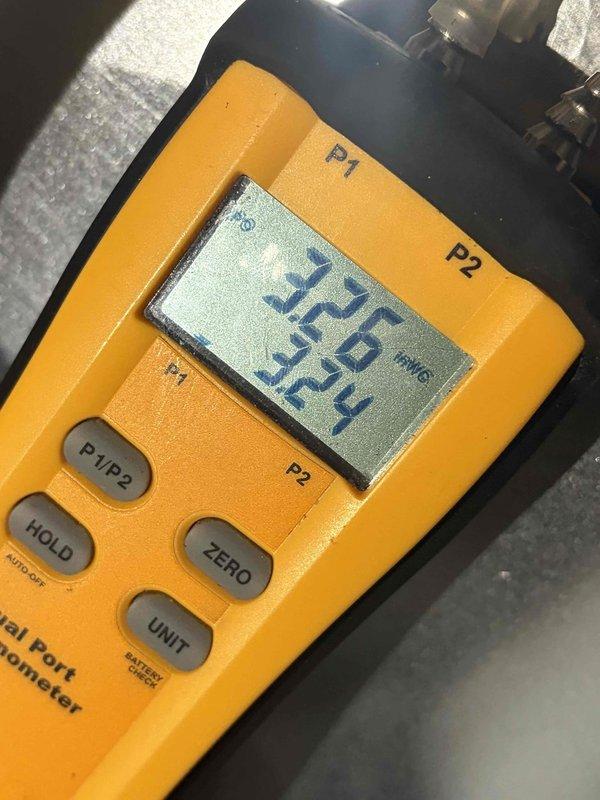Completed final prepaid maintenance visit on air handler system. Performed comprehensive electrical diagnostics using clamp meter, recording amperage draw of 4.8 amps with voltage readings at 201 volts. Utilized dual port manometer to measure static pressures across the system, documenting readings of 0.126 and 0.324 inches water column to verify proper airflow and system performance within manufacturer specifications.
