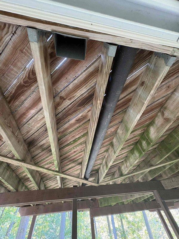 Responded to service call for HVAC system with continuously running fan issue at property under new ownership. Conducted comprehensive system evaluation and documented existing ductwork configuration, including exterior exhaust routing through covered porch area and interior basement installation with galvanized metal ductwork and proper copper refrigerant line placement. Provided estimate for complete system replacement to address operational concerns and ensure reliable climate control for new homeowner.