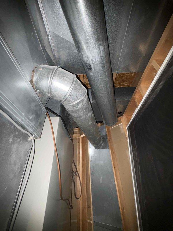 Responded to service call for HVAC system with continuously running fan issue at property under new ownership. Conducted comprehensive system evaluation and documented existing ductwork configuration, including exterior exhaust routing through covered porch area and interior basement installation with galvanized metal ductwork and proper copper refrigerant line placement. Provided estimate for complete system replacement to address operational concerns and ensure reliable climate control for new homeowner.