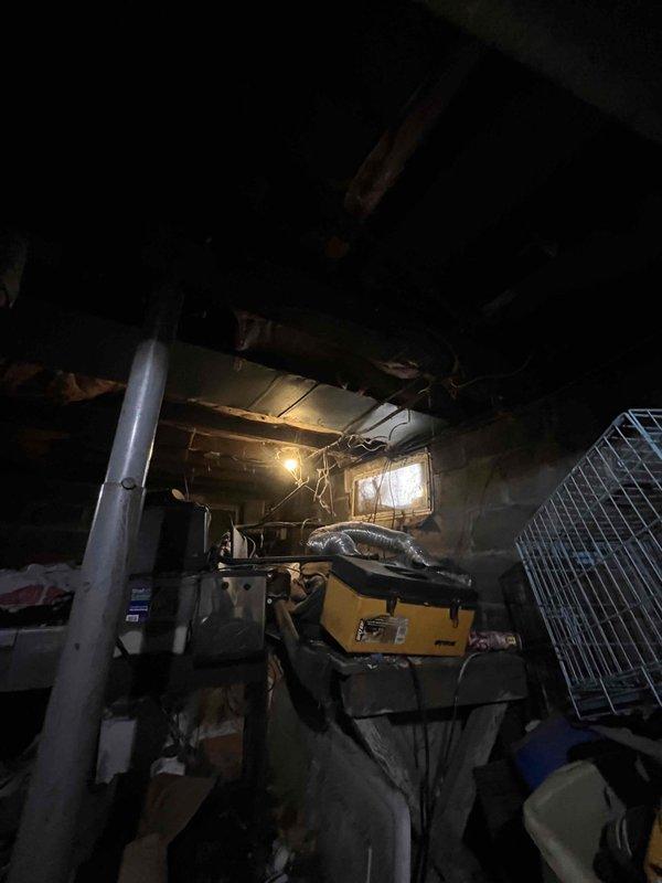 Conducted on-site assessment of existing gas heating system in residential property for replacement estimate. Customer reported operational issues experienced at end of previous season. Inspected current equipment located in basement/crawlspace area, documented existing gas furnace configuration, and confirmed absence of air conditioning system. Photographed mechanical equipment, ductwork, and installation environment to determine replacement requirements and access considerations for future installation.