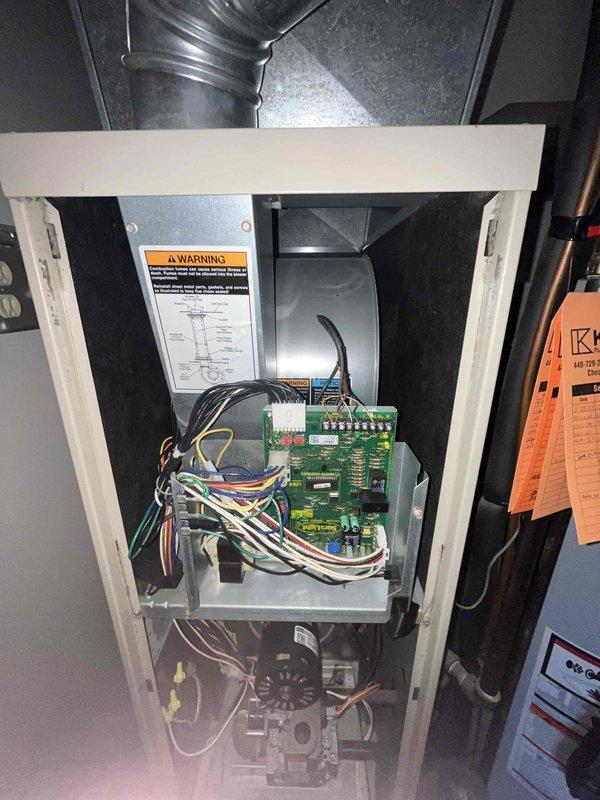 Completed annual heating system inspection and tune-up on furnace of unknown age. System was reported to be operating properly with no issues or symptoms. Performed comprehensive inspection of unit, accessing control board and electrical connections. Verified all wire connections secure at control board including power, thermostat, and safety circuit wiring. Inspected blower motor assembly and internal components for proper operation. Checked ductwork connections and cabinet integrity. All safety controls and electrical components found in good working condition. Customer provided their own air filter for installation. System tested and confirmed operational with no deficiencies noted at time of service.