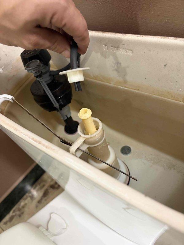 Responded to master bathroom odor complaint. Inspected and serviced shower drain assembly, removing debris and buildup that homeowner was unable to clear. Also inspected and serviced toilet tank fill valve mechanism to ensure proper operation and rule out additional sources of odor.