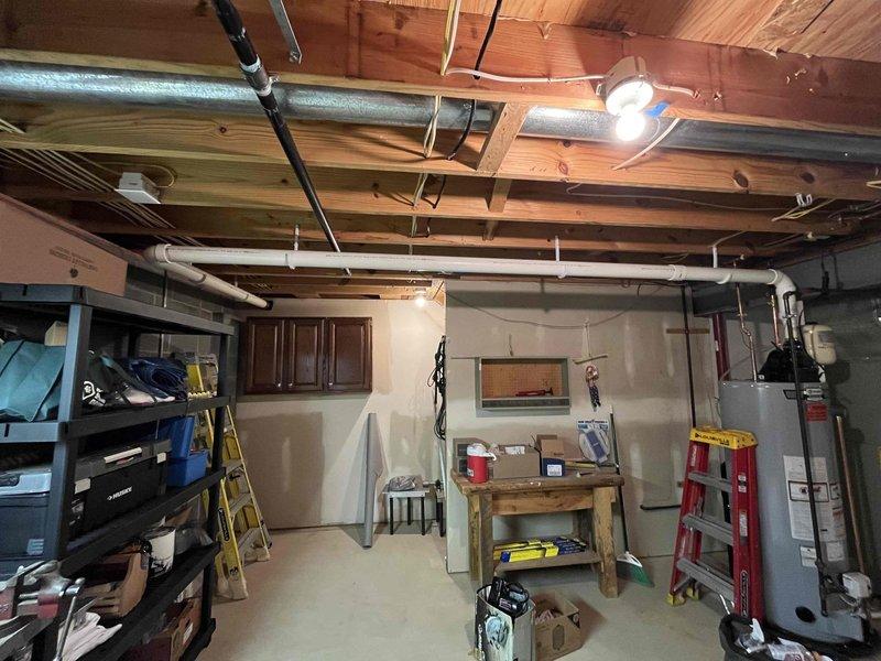 Installed 50-gallon AO Smith power vent water heater in basement utility room. Completed all plumbing connections including copper supply lines and PVC vent piping, installed expansion tank, and verified proper operation of power vent motor assembly.