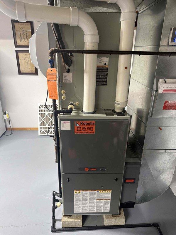 Completed heating maintenance club visit on Trane furnace system. Performed comprehensive system inspection, verified electrical amperage draw at 7.25A indicating normal blower motor operation, and confirmed proper voltage readings. Changed air filter and documented equipment condition with service photos per maintenance agreement protocol.