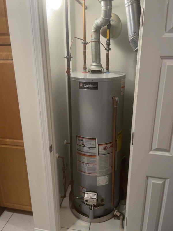Responded to a no hot water complaint at a residential property with a Lochinvar tanked water heater. Upon arrival, performed diagnostic inspection of the unit and associated components. Inspected the gas control valve, thermocouple, and pilot assembly for proper operation. Examined electrical connections and found several loose or disconnected wires at the control panel that were preventing proper ignition sequence. Reconnected and secured all electrical wiring to manufacturer specifications.

Tested gas supply pressure and verified adequate flow to the burner assembly. Inspected the flue venting system, including both rigid and flexible ductwork sections, to ensure proper draft and exhaust of combustion gases. Checked copper water supply lines and connections for leaks or restrictions. Verified the temperature and pressure relief valve was functioning correctly and properly installed.

Relit the pilot light and cycled the burner through multiple heating cycles to confirm proper ignit
