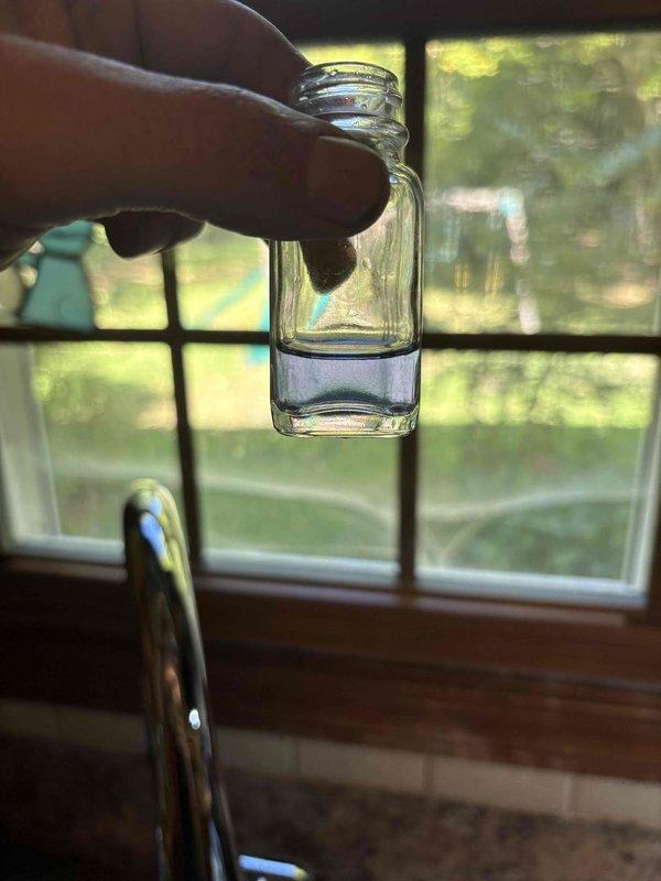 Completed warranty return service for a chrome single-handle pull-down kitchen faucet. Removed defective unit, documented faulty internal cartridge component with photographic evidence, and processed manufacturer warranty claim for customer replacement.