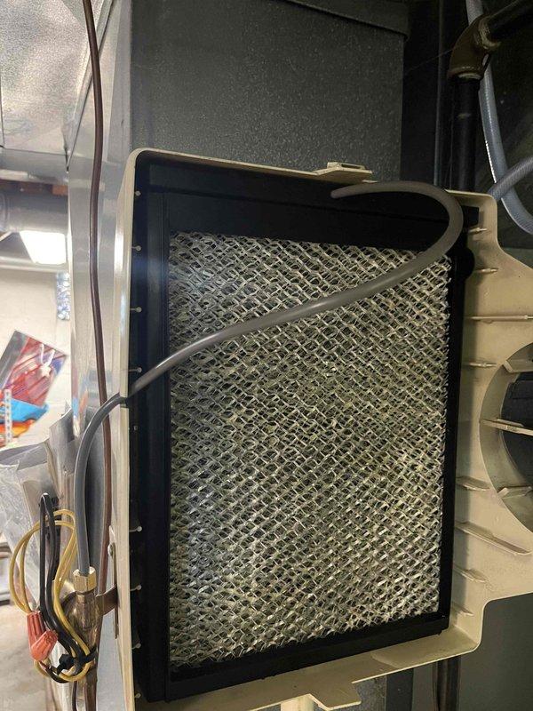 Returned to complete humidifier rebuild as previously sold. Accessed HVAC system and removed existing humidifier components from air handler assembly. Disassembled humidifier unit and replaced internal water panel, feed tube, and distribution tray. Inspected and cleaned humidifier housing, removing mineral deposits and debris buildup. Reinstalled rebuilt humidifier assembly onto air handler plenum with proper mounting hardware. Verified water supply line connection and tested solenoid valve operation for proper flow. Confirmed humidistat wiring connections and system integration with existing HVAC controls. Replaced air filter in filter housing during service. Tested humidifier operation through complete cycle to ensure proper water distribution and drainage. System operating as designed with no leaks detected.