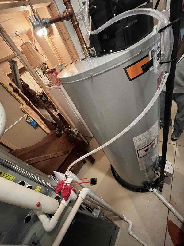 Completed club membership renewal service and performed heating system maintenance on air handler unit. Conducted temperature diagnostics using digital thermometer, recording ambient readings of 82.4°F in mechanical area. Inspected residential HVAC equipment including water heater, plumbing connections, and associated mechanical systems in basement utility space. All heating components operating within normal parameters at time of service.