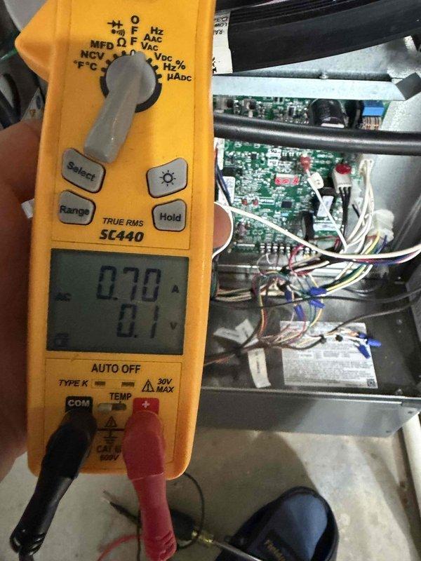 Completed heating maintenance club visit on air handler unit. Performed electrical diagnostics using digital multimeter, recording amperage draw of 0.70A and voltage reading of 0.1V at control board. Measured resistance at 467 ohms on system components. Inspected control board circuitry, terminal connections, and wiring harness. All readings documented photographically for service records. System operational upon completion of diagnostics.