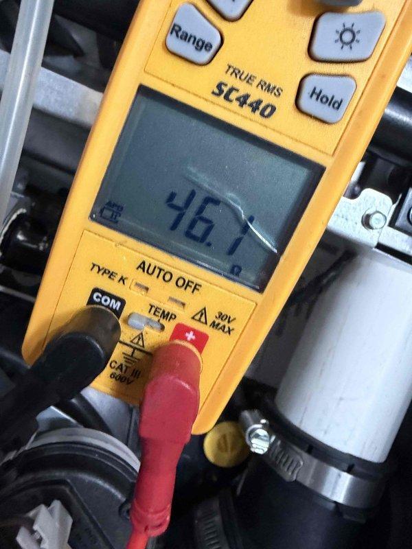 Completed heating maintenance club visit on air handler unit. Performed electrical diagnostics using digital multimeter, recording amperage draw of 0.70A and voltage reading of 0.1V at control board. Measured resistance at 467 ohms on system components. Inspected control board circuitry, terminal connections, and wiring harness. All readings documented photographically for service records. System operational upon completion of diagnostics.