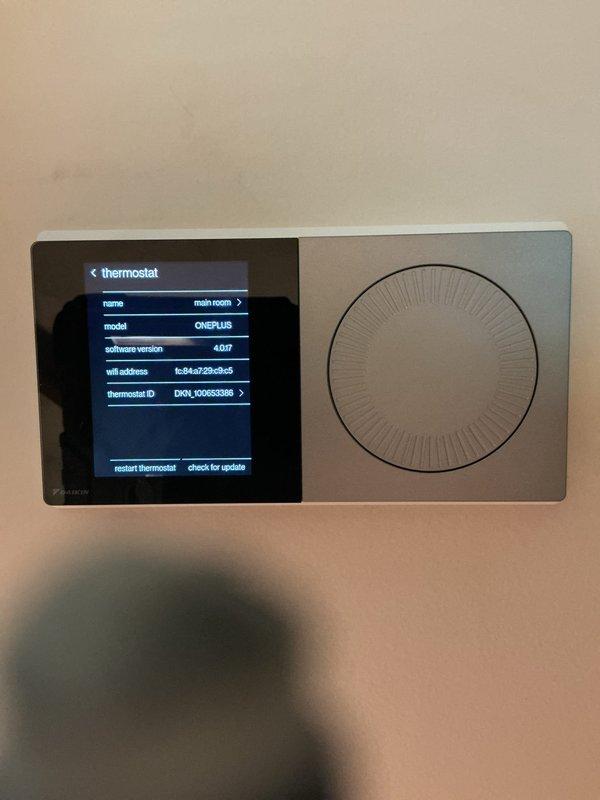 Completed callback for full HVAC system installation. Verified Daikin smart thermostat installation and proper system configuration, confirmed thermostat display showing correct model identification, software version 4.0.07, and WiFi connectivity established for remote operation capability.