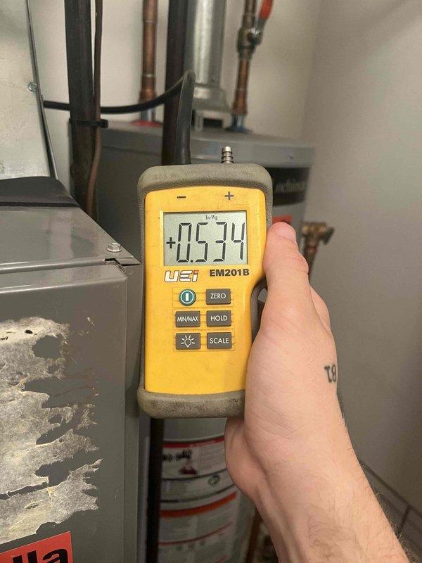 Completed heating maintenance club visit on air handler system. Performed comprehensive system diagnostics including gas pressure measurements using digital manometer, recording 0.574" reading at equipment. Conducted supply air temperature verification at floor register, measuring 180°F output to confirm proper heating operation. Inspected mechanical equipment including water heater and associated piping systems. Documented all equipment conditions and system performance parameters with photographic evidence. All measurements within acceptable operating ranges. System operating efficiently with no deficiencies noted.