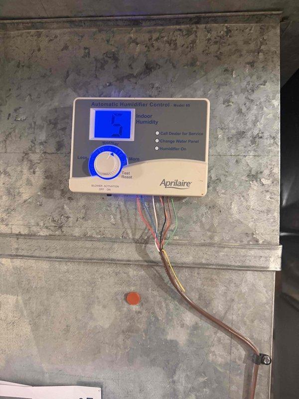 Completed comprehensive heating maintenance on three HVAC units as part of club membership renewal visits. Inspected and serviced Aprilaire Model 60 humidifier control system, verified proper operation with digital display reading 57% indoor humidity, and assessed air filtration system with noted filter replacement need. All equipment accessed through garage entry per customer request, with maintenance plans renewed for continued service coverage.