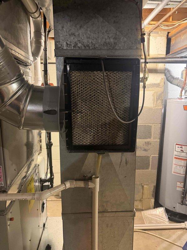 Completed comprehensive heating maintenance on three HVAC units as part of club membership renewal visits. Inspected and serviced Aprilaire Model 60 humidifier control system, verified proper operation with digital display reading 57% indoor humidity, and assessed air filtration system with noted filter replacement need. All equipment accessed through garage entry per customer request, with maintenance plans renewed for continued service coverage.