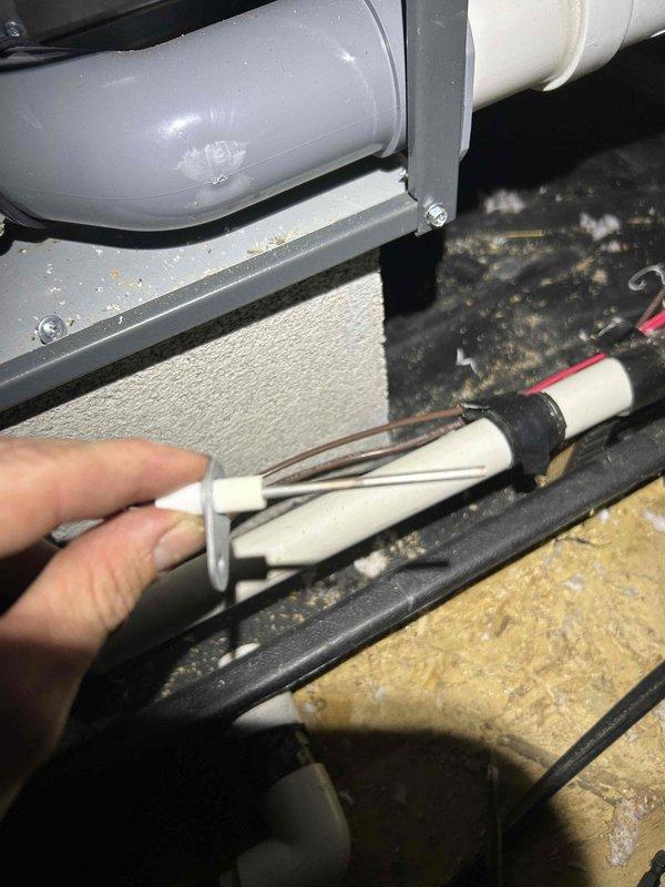 Responded to no heat call for 4-year-old furnace located in attic. Upon inspection, discovered faulty flame sensor preventing ignition sequence from completing. Sensor rod showed heavy carbon buildup and oxidation causing loss of electrical conductivity. Removed flame sensor from burner assembly, cleaned electrode with emery cloth to restore proper surface contact, and reinstalled component. Verified all wire connections at control board and gas valve were secure. Tested system through multiple heating cycles to confirm proper ignition, flame recognition, and burner operation. System restored to full operational status with normal heat output throughout home.