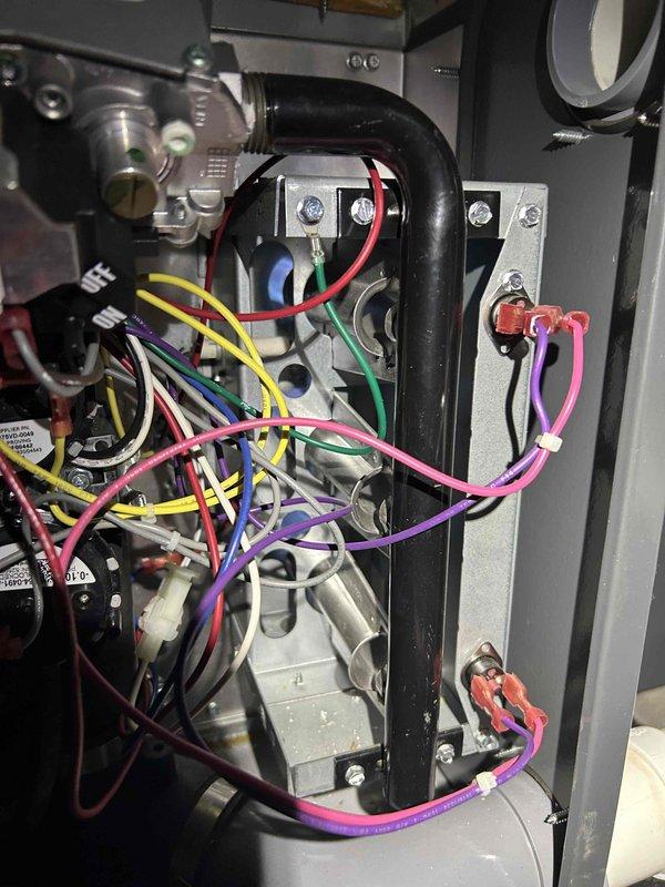 Responded to no heat call for 4-year-old furnace located in attic. Upon inspection, discovered faulty flame sensor preventing ignition sequence from completing. Sensor rod showed heavy carbon buildup and oxidation causing loss of electrical conductivity. Removed flame sensor from burner assembly, cleaned electrode with emery cloth to restore proper surface contact, and reinstalled component. Verified all wire connections at control board and gas valve were secure. Tested system through multiple heating cycles to confirm proper ignition, flame recognition, and burner operation. System restored to full operational status with normal heat output throughout home.