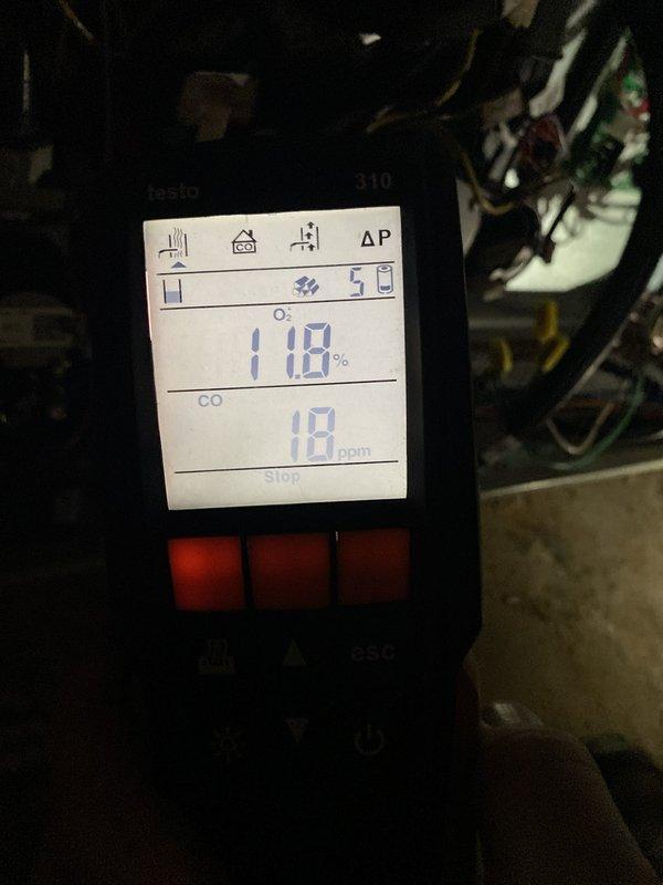 Completed heating system start-up and commissioning following new installation. Propane fuel was delivered to site, enabling full system activation and performance verification. Conducted comprehensive combustion analysis using digital testing equipment, confirming optimal air-fuel mixture with oxygen levels at 11.8% and carbon monoxide readings at 18 ppm, both within acceptable parameters for safe and efficient operation.